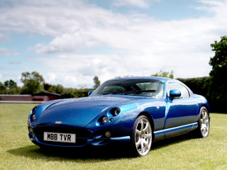 Blue sports car grass field 3 - david imms free wallpaper for desktop