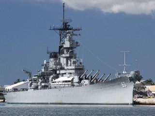 Battleship docked water dock building - a flag free wallpaper