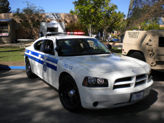 Police car parking lot truck - a parking lot next free wallpaper