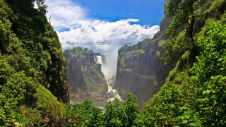 Waterfall view trees blue sky - a distance free wallpaper