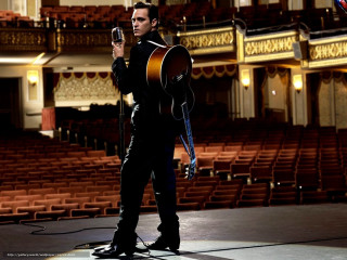 Man holding guitar auditorium microphone - a large auditorium free wallpaper