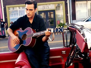 Man sitting red car guitar - a guitar free wallpaper