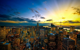 City skyline sunset clouds water - city background free wallpaper