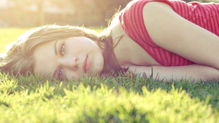 Woman laying grass red shirt - portrait photography free wallpaper