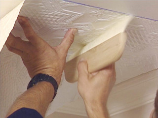 Man working ceiling tape paper - a ceiling free wallpaper