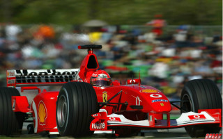 Red race car motion blur - a crowd in the background free wallpaper