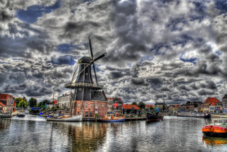Windmill water boats cloudy sky - a windmill free wallpaper