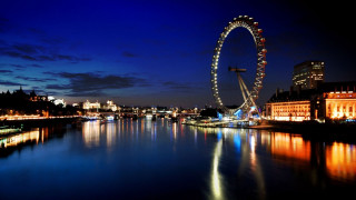 Ferris wheel night water buildings - the background and a city skyline free wallpaper