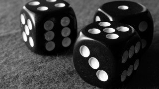 Black dices on table next - rpg free wallpaper