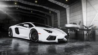 White sports car hangar plane - the ground in front free wallpaper