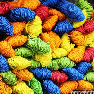 Multicolored yarn pile table basket - top of a table next free wallpaper