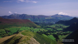 Valley mountains lake clouds sky - the background and a lake in the foreground free wallpaper