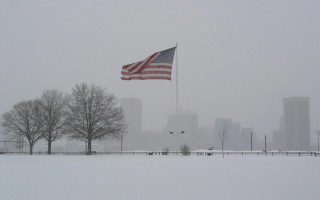 Flag waving snowy park cityscape - christopher moeller free wallpaper