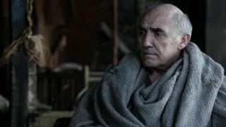 Man scarf sitting chair wall - a scarf free wallpaper