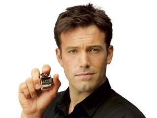 Man holding small bottle cologne - detail free wallpaper
