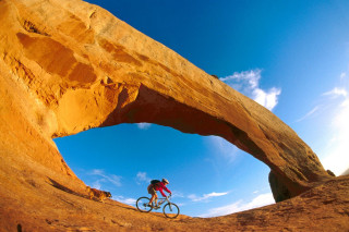 Man bike desert rock arch 6 - a bike free wallpaper