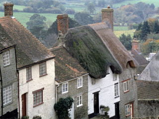 Thatched houses green field architecture - a row of houses free wallpaper