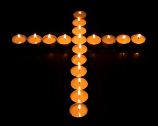 Candles cross table dark night - a cross free wallpaper