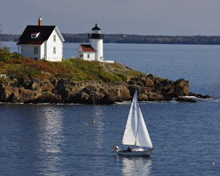 Sailboat water lighthouse rocky island - a lighthouse in the background free wallpaper