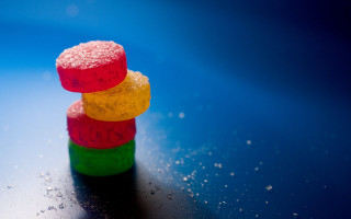 Colorful candies stack table blue 2 - a stack free wallpaper