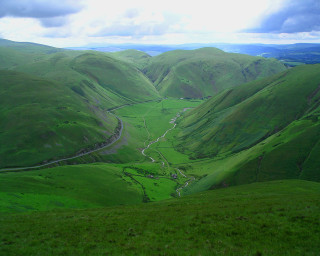 Green valley winding road cloudy - a green valley free wallpaper