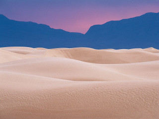 Desert mountain range pink sky 3 - a mountain range in the distance free wallpaper