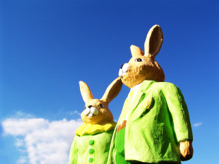 Rabbit statues green outfits sunny - a sunny day free wallpaper
