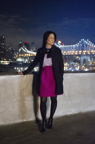 Woman standing ledged city skyline - free city wallpaper for mobile