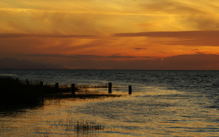Sunset ocean boat fence mountain 3 - distant free wallpaper