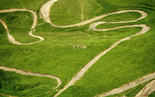 Green field white house middle - artwork free wallpaper