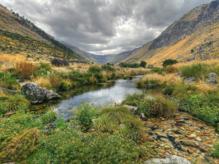 River lush valley cloudy sky - the background and grass free wallpaper