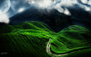 Winding road green valley mountain - a lush green valley under a cloudy sky free wallpaper