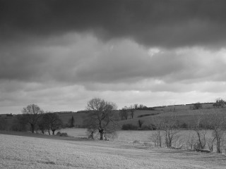 Stormy cloudy mountainous horizon black - photo of a field free wallpaper