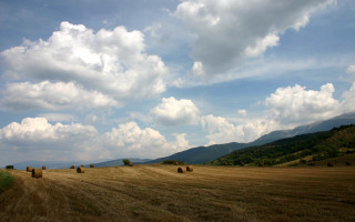 Hay field mountains clouds sky 2 - landscape free wallpaper for desktop