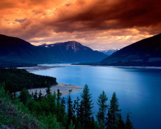 Lake mountains cloudy red sky 2 - tree below free wallpaper