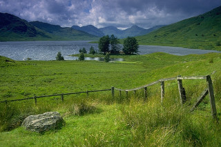 Grassy field wooden fence lake - alexander johnston free wallpaper for desktop
