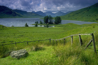Grassy field wooden fence lake 2 - alexander johnston free wallpaper for desktop
