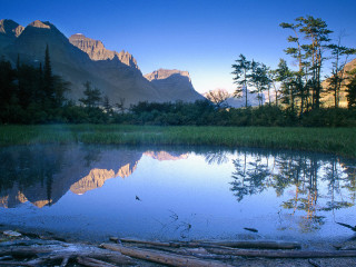 Lake mountains trees logs foreground 4 - mountain and trees free wallpaper
