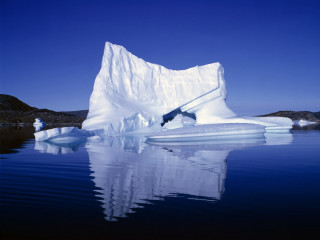 Large iceberg lake blue sky - a few iceberg free wallpaper