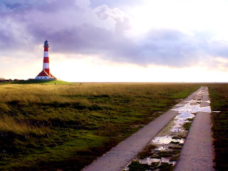 Road lighthouse cloudy puddle grass - a puddle of water free wallpaper