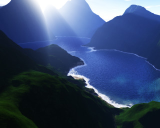 Large body of water mountains - volumetric light free wallpaper