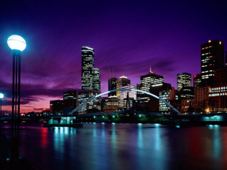 City skyline bridge light pole - a purple sky in the background free wallpaper for desktop