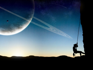 Man swinging rope planet saturn - a distant object in the sky free wallpaper