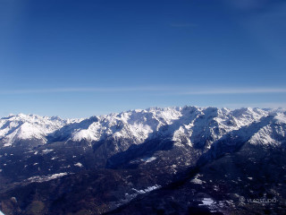 Mountain range airplane window blue 3 - an airplane window free wallpaper
