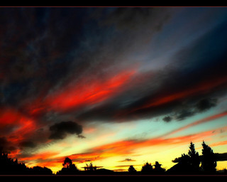 Sunset red blue sky clouds - a few house free wallpaper