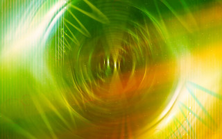 Green yellow abstract background circular 4 - a circular design in the center of the image free wallpaper