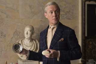 Man suit holding object statue - a small object free wallpaper