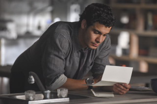 Man looking paper table pen - his hand free wallpaper