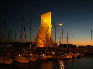 Boats parked water night time - almada negreiro free wallpaper