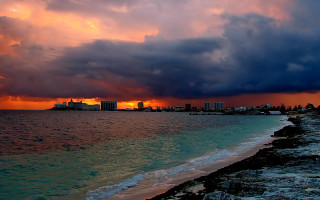 Sunset city ocean cloud beach 3 - a beach in the foreground free wallpaper